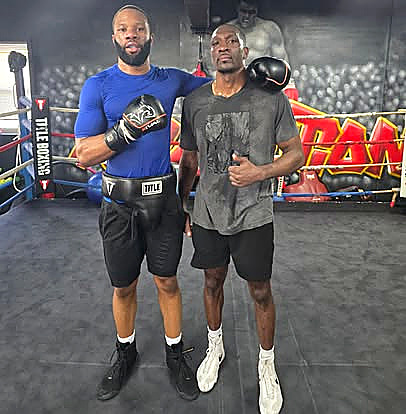 Adult boxers training in the ring at Blue Boy Boxing Club